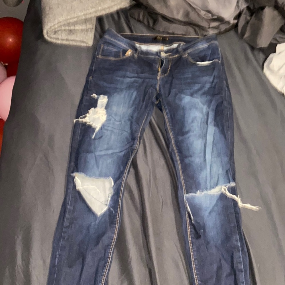 Dark blue ripped jeans